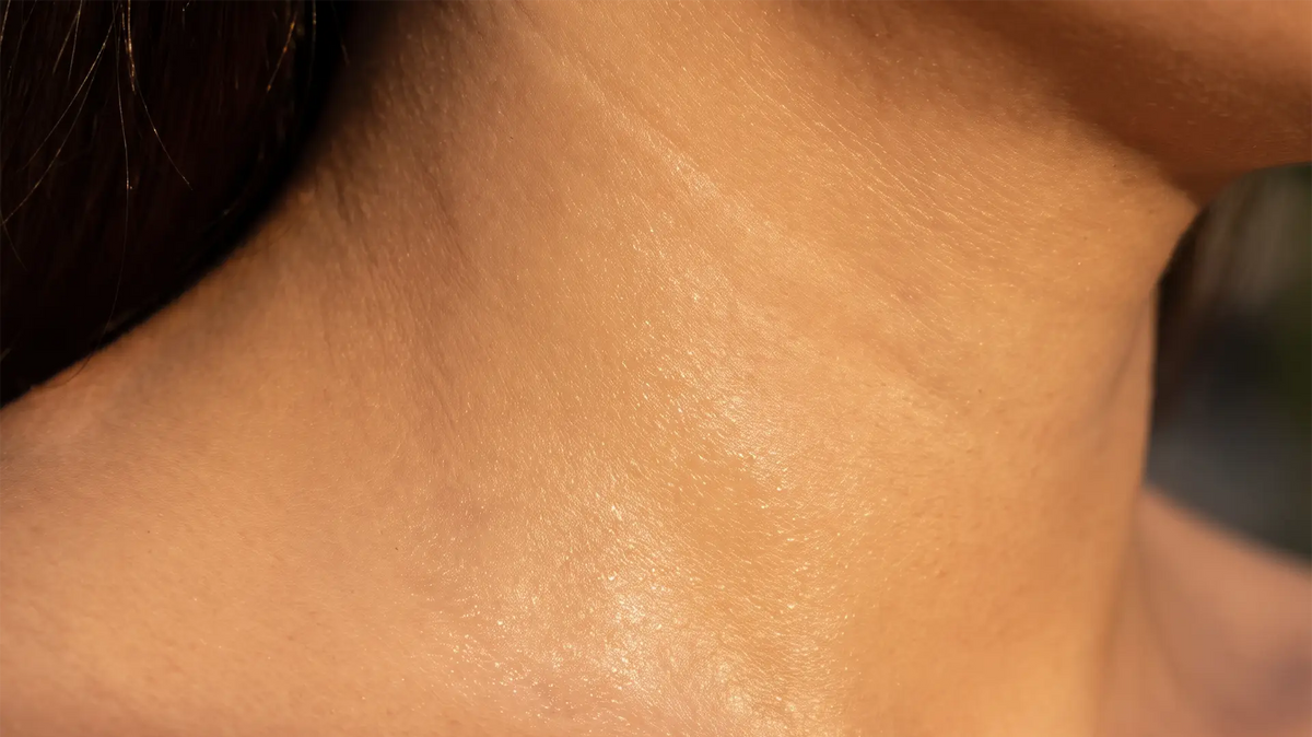 Close-up of hydrated skin showing a smooth, naturally radiant skin surface.