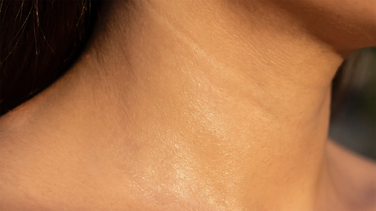 Close-up of hydrated skin showing a smooth, naturally radiant skin surface.