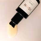 Cosmetic bottle with a label on a light background