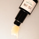 ISUN emerald eye gel bottle with a beige background