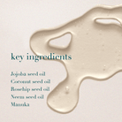 Skin care product with key ingredients listed on a light background