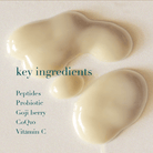 Cream with text listing key ingredients on a light background