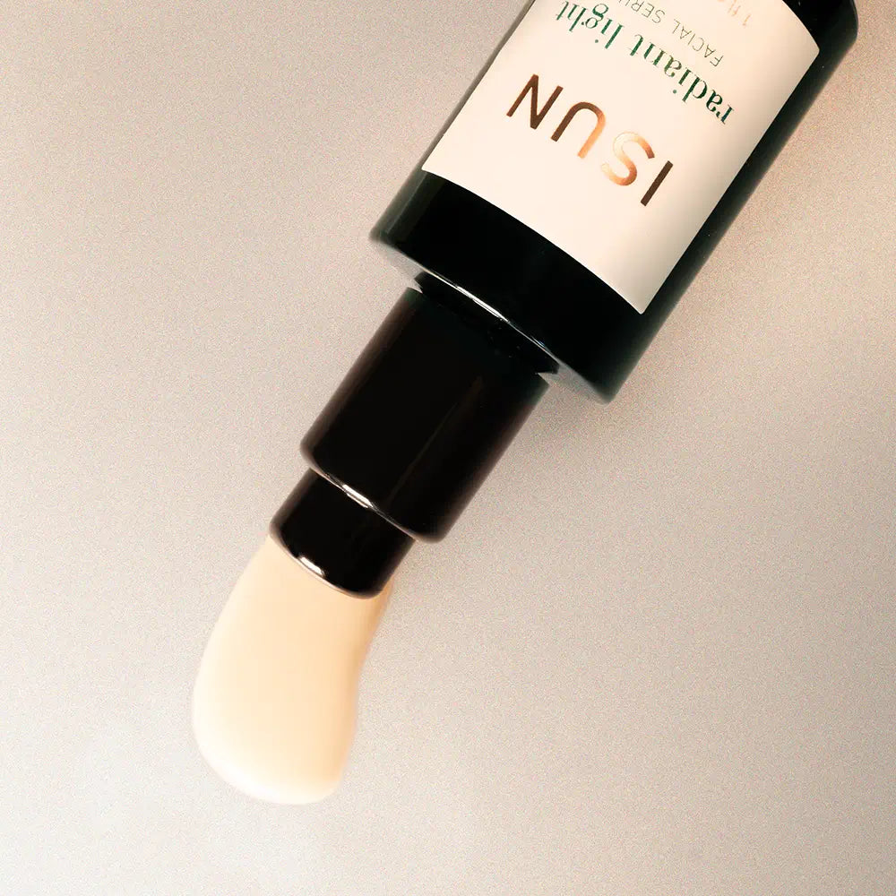 Cosmetic bottle with a pump on a neutral background