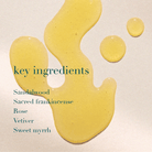 Yellow liquid droplets on a beige background with text listing key ingredients.