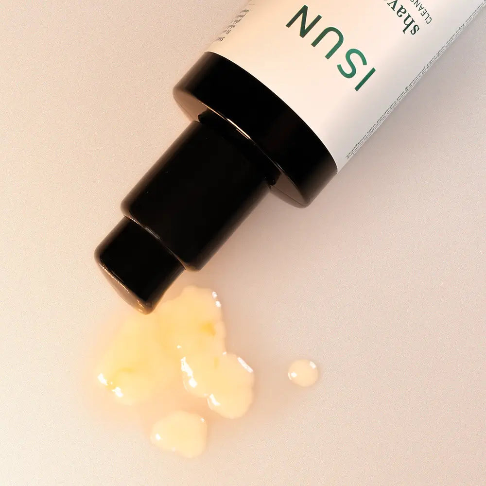 ISUN skincare product with cream being pumped out on a light background