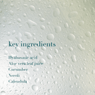Text listing key ingredients on a textured background with water droplets