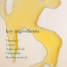 Product with a yellow and white design and text listing key ingredients on a beige background