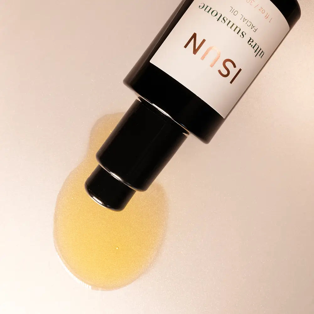 Bottle with yellow powder and ISUN label on a beige background