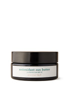 Jar of antioxidant sun butter with black lid on a white background