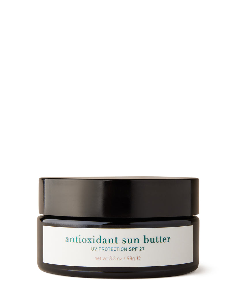 Jar of antioxidant sun butter with black lid on a white background